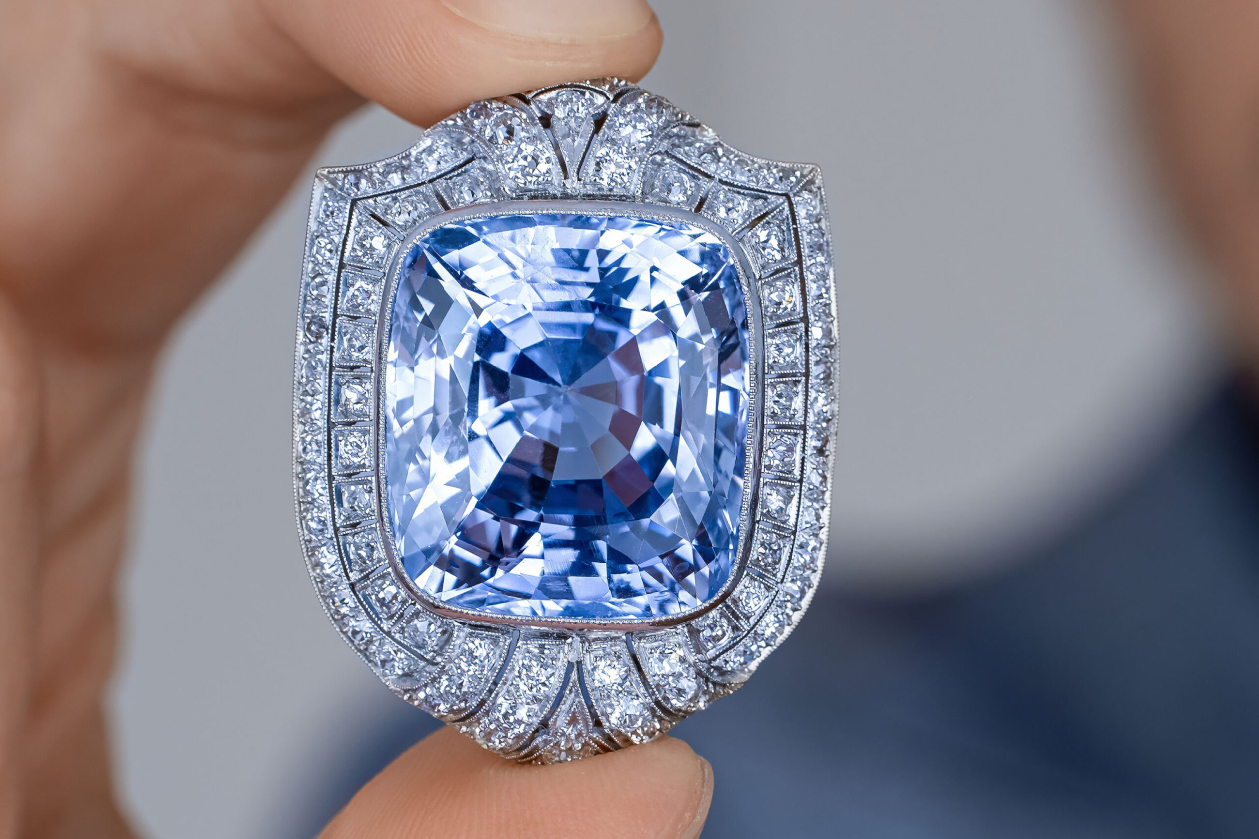 A cushion-cut deep blue sapphire with exceptional brilliance.