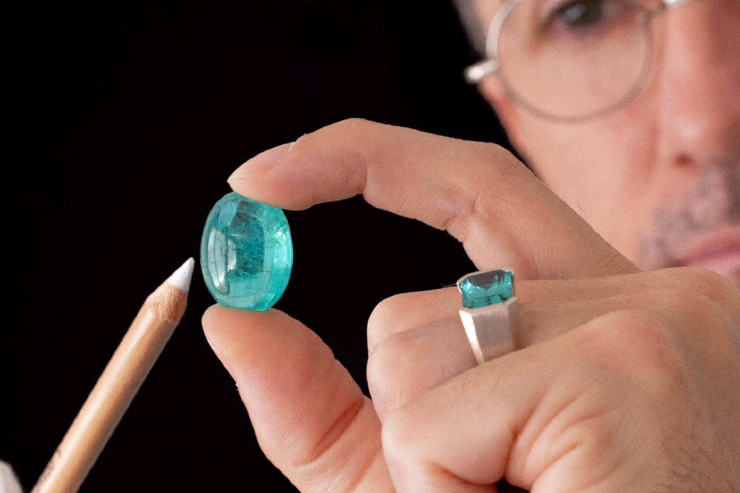 Eduard Grygorian holding gemstone in the hand