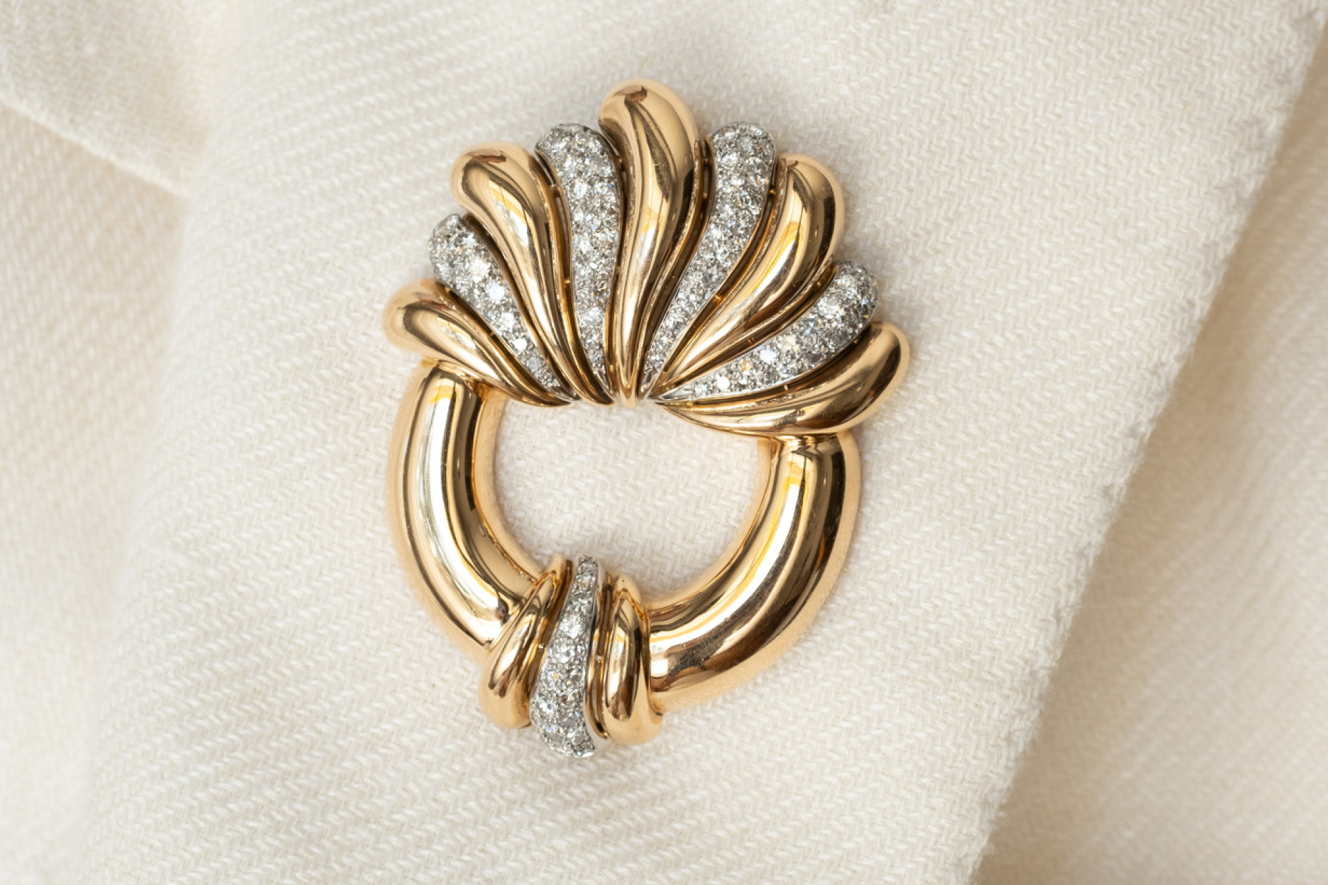 Vintage Diamond & Gold brooch on the white suit