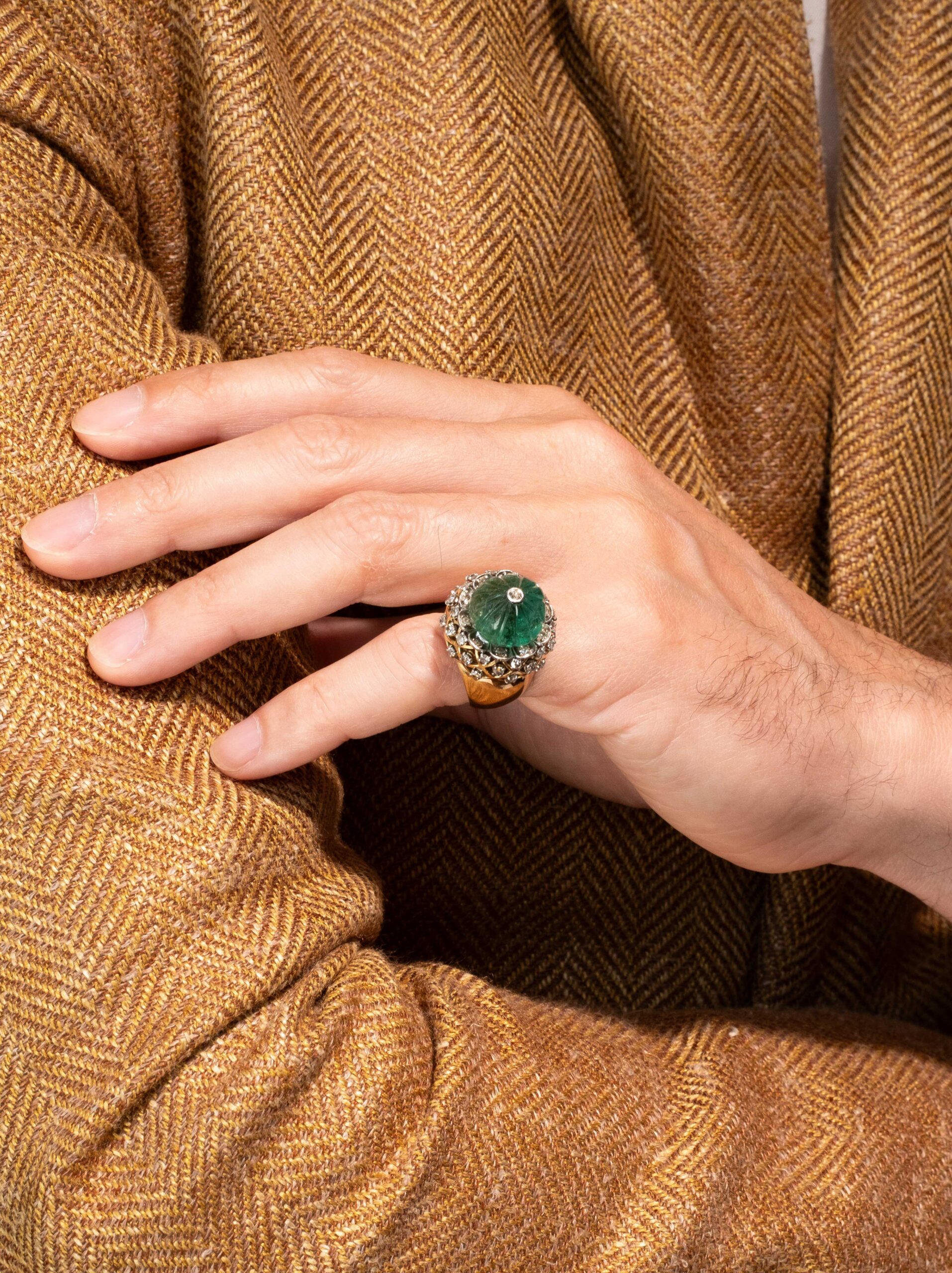 Mellerio dits Meller “Chardon” Ring on the Finger of Eduard Grygorian in an orange suit