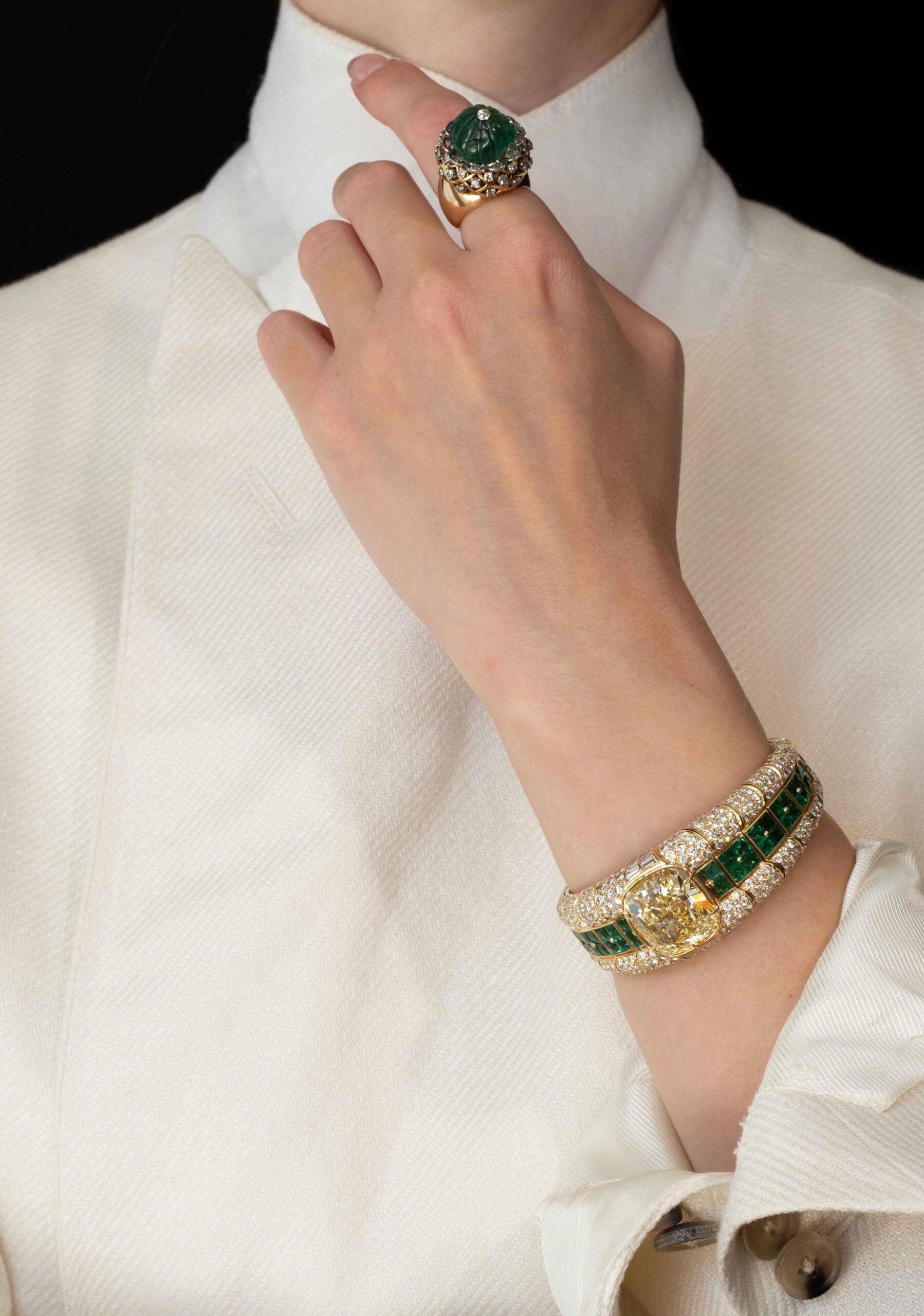 Bulgari Coloured Diamond and Emerald Bangle Bracelet on the Woman's Hand