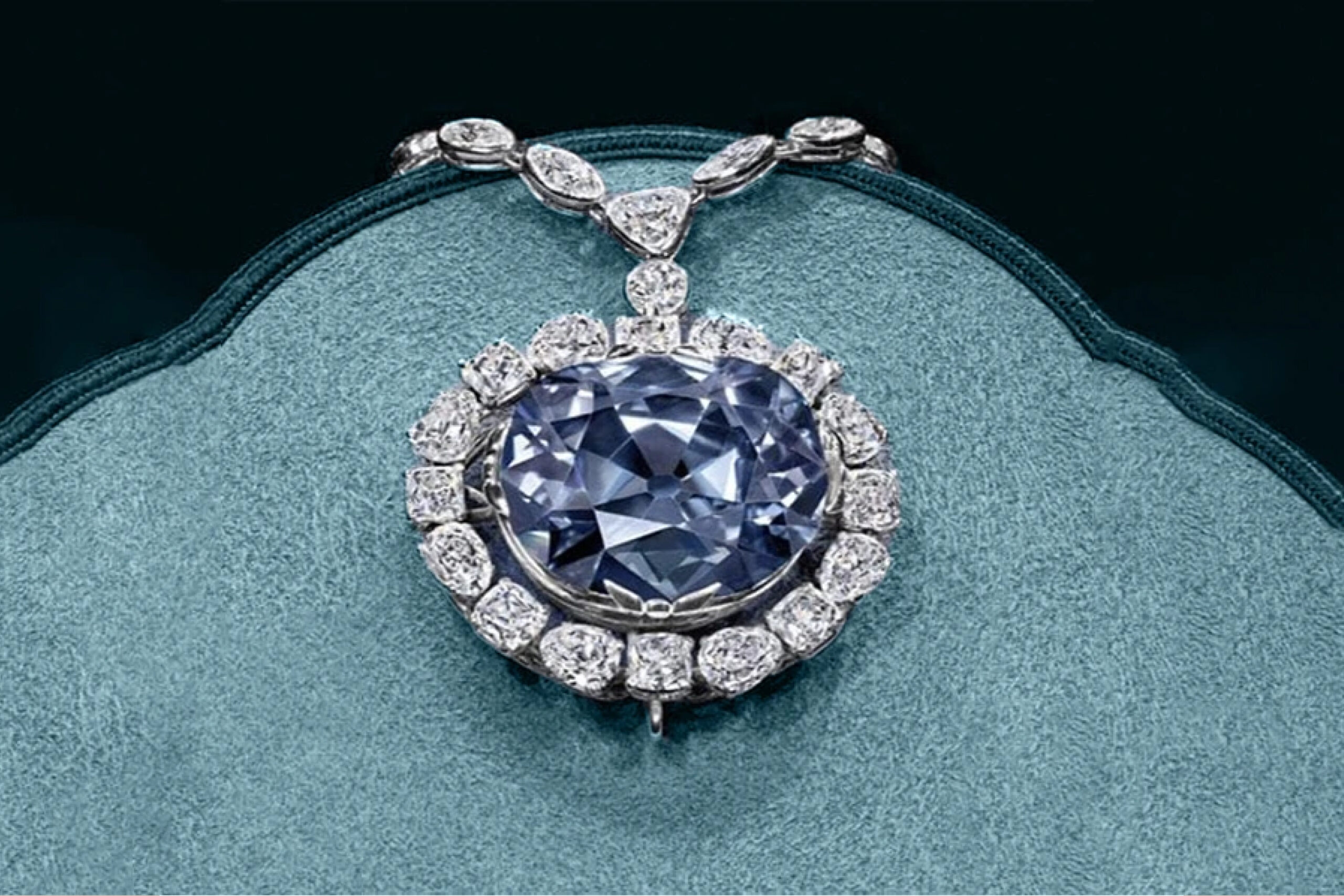 The famous Hope Diamond, a 45.52 carat blue diamond, on the blue background