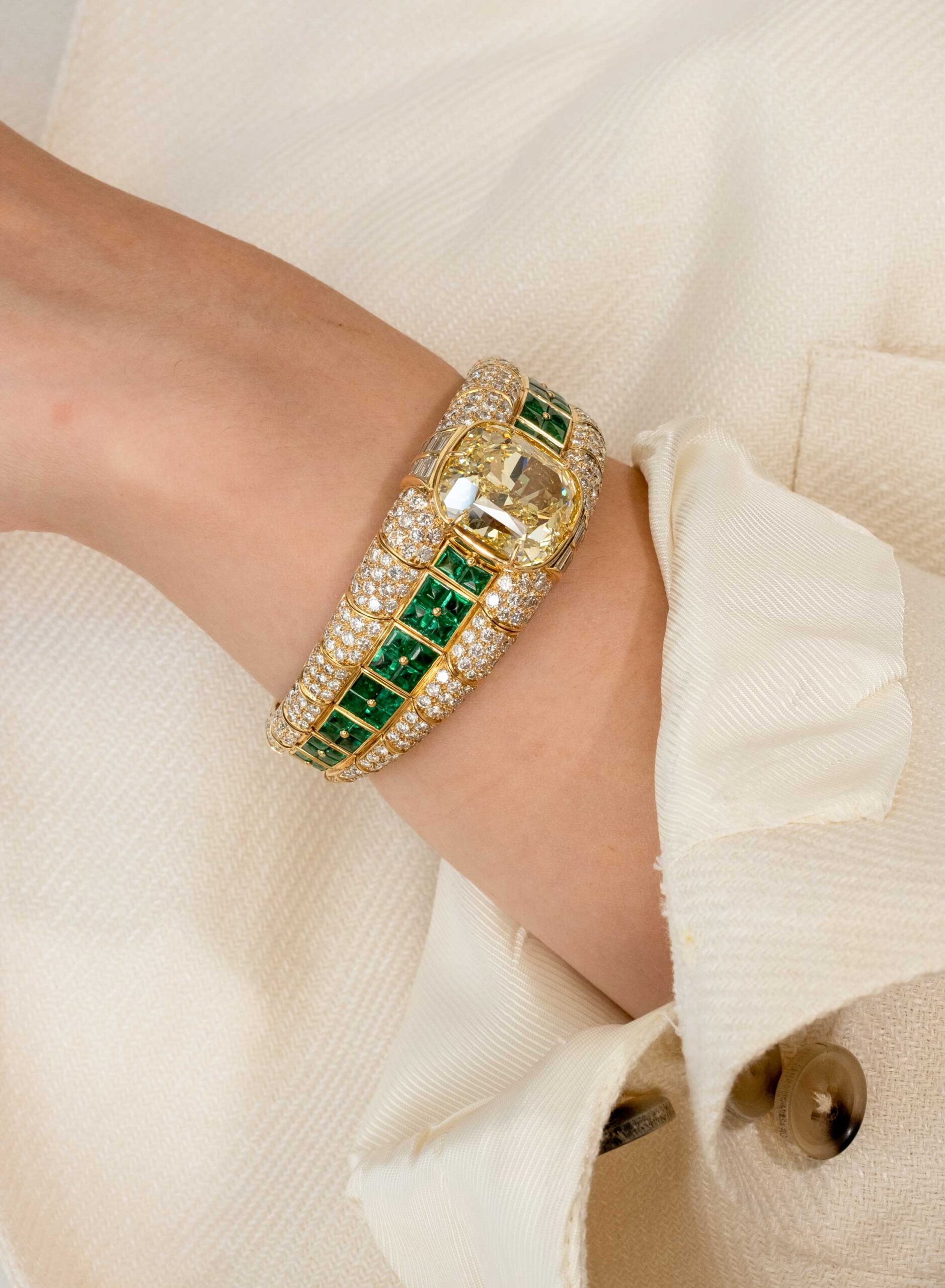 Bulgari Coloured Diamond and Emerald Bangle Bracelet on the Woman's Hand