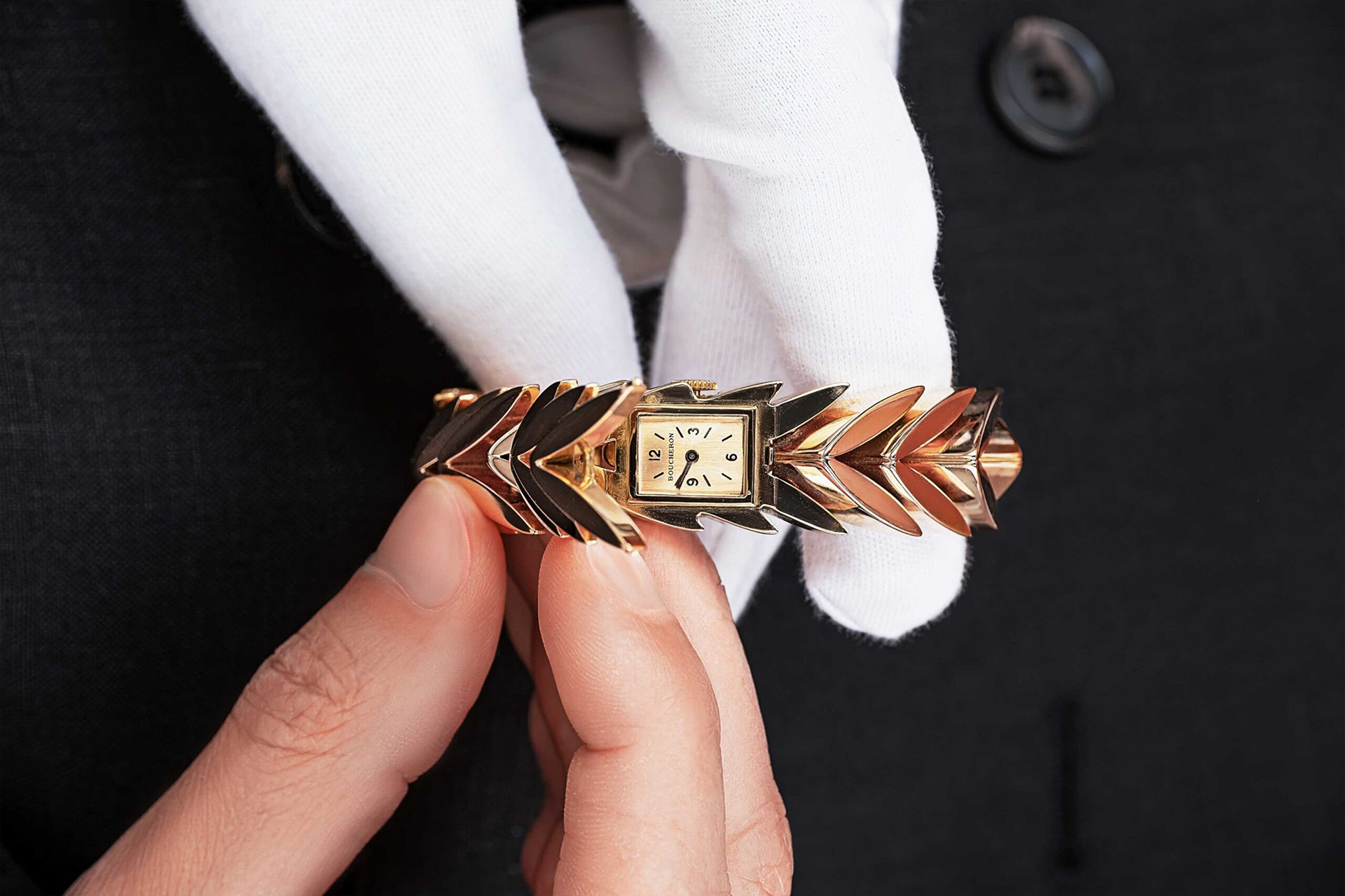 Boucheron watch in hands and white gloves