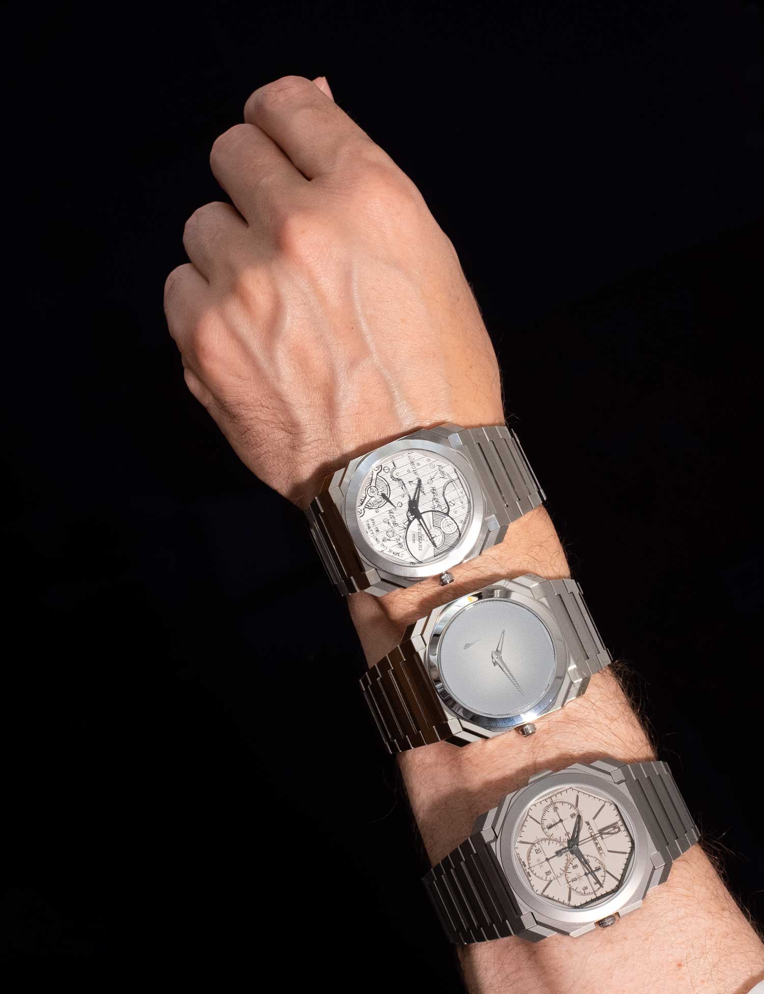 Three modern watches on one hand