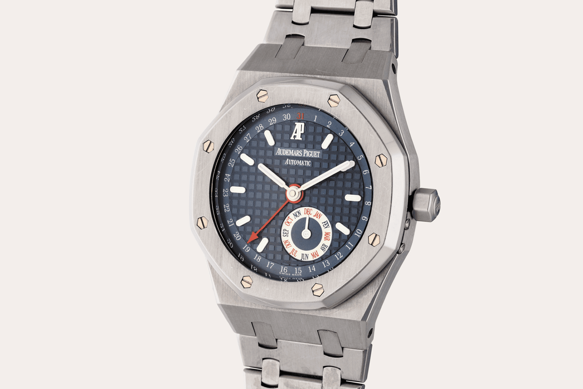 The image shows a wristwatch with a metal bracelet and case.