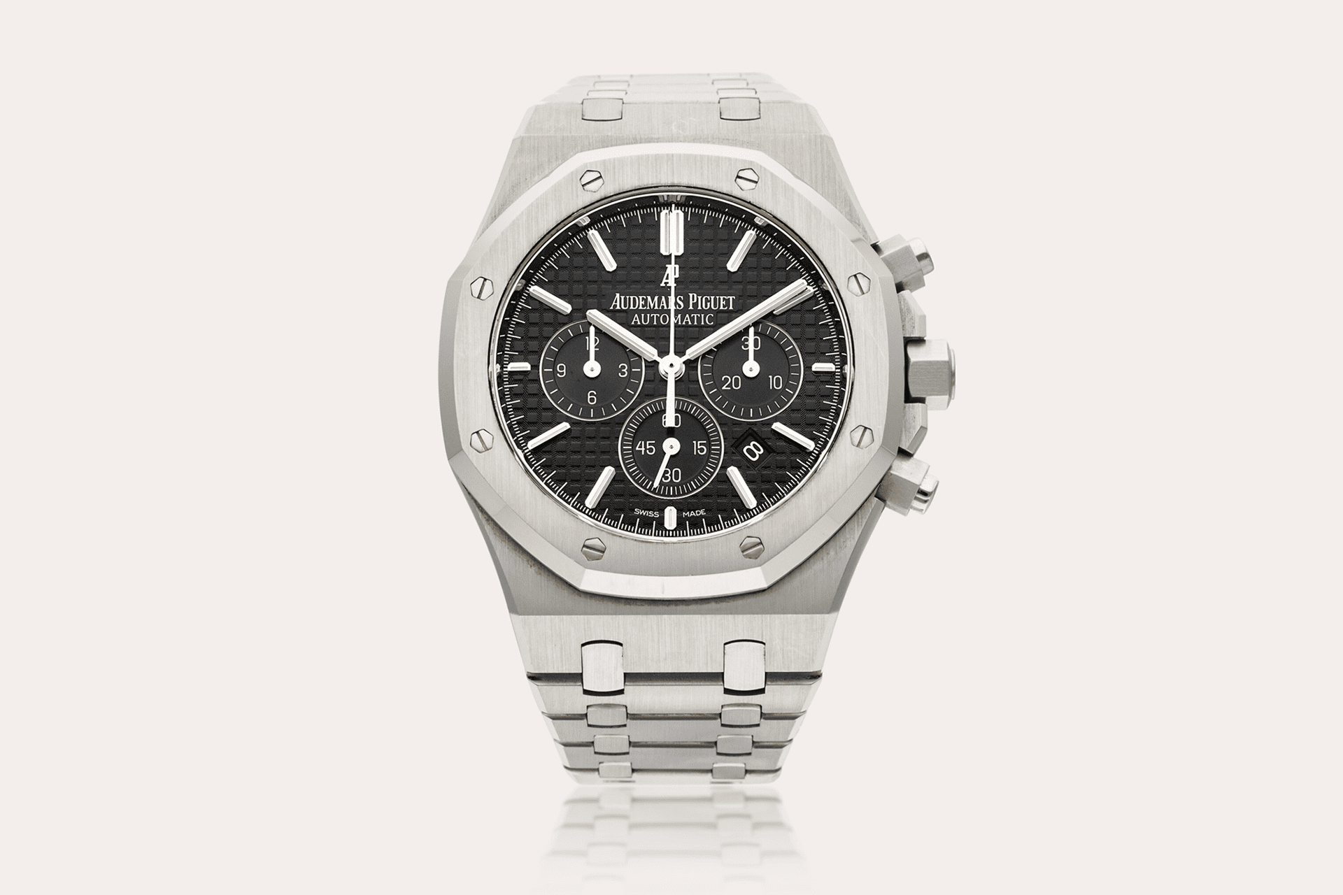 The image shows a wristwatch with a silver case and bracelet.