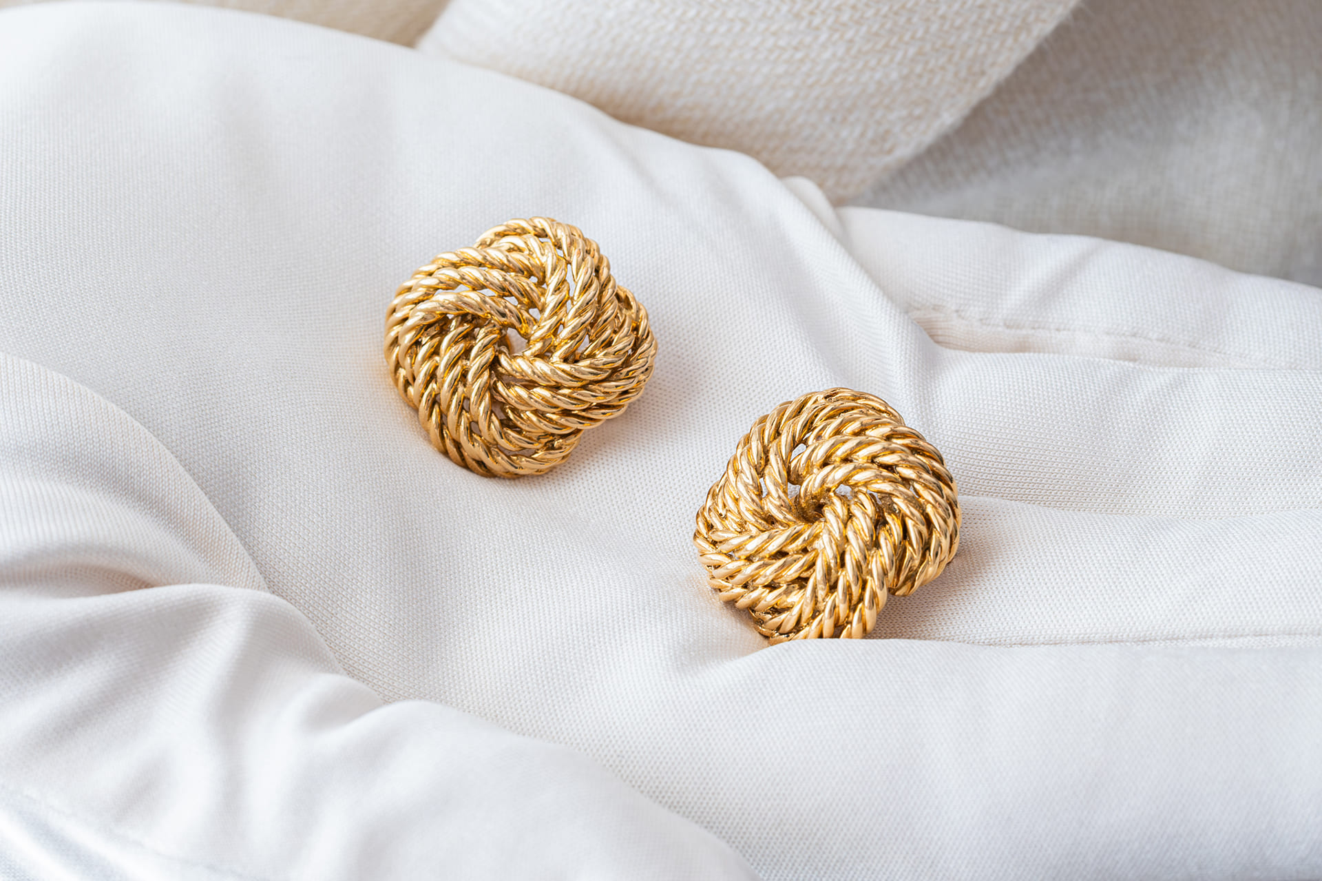 Golden earrings white glove