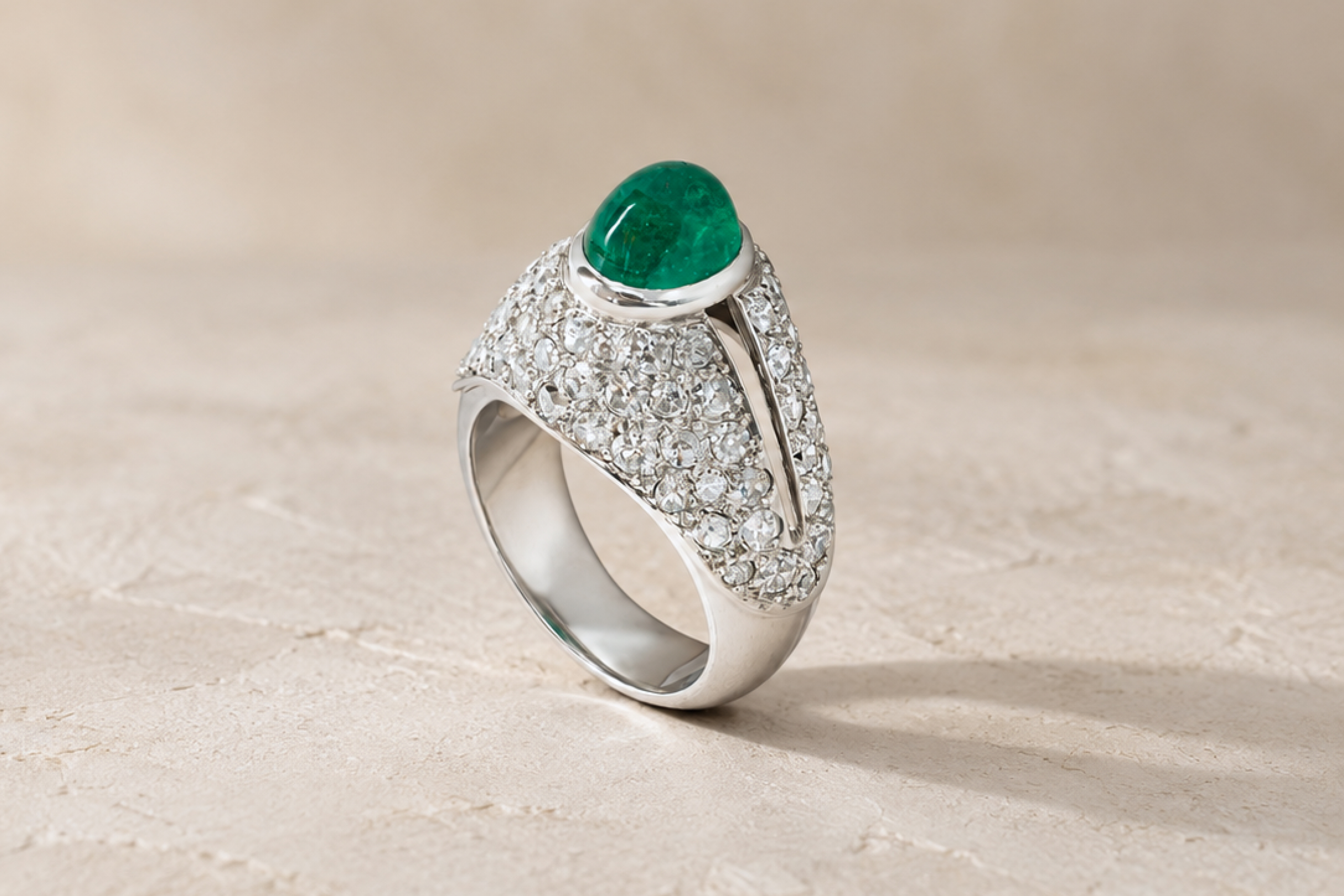 Art Deco emerald and diamond ring in platinum with a cabochon emerald