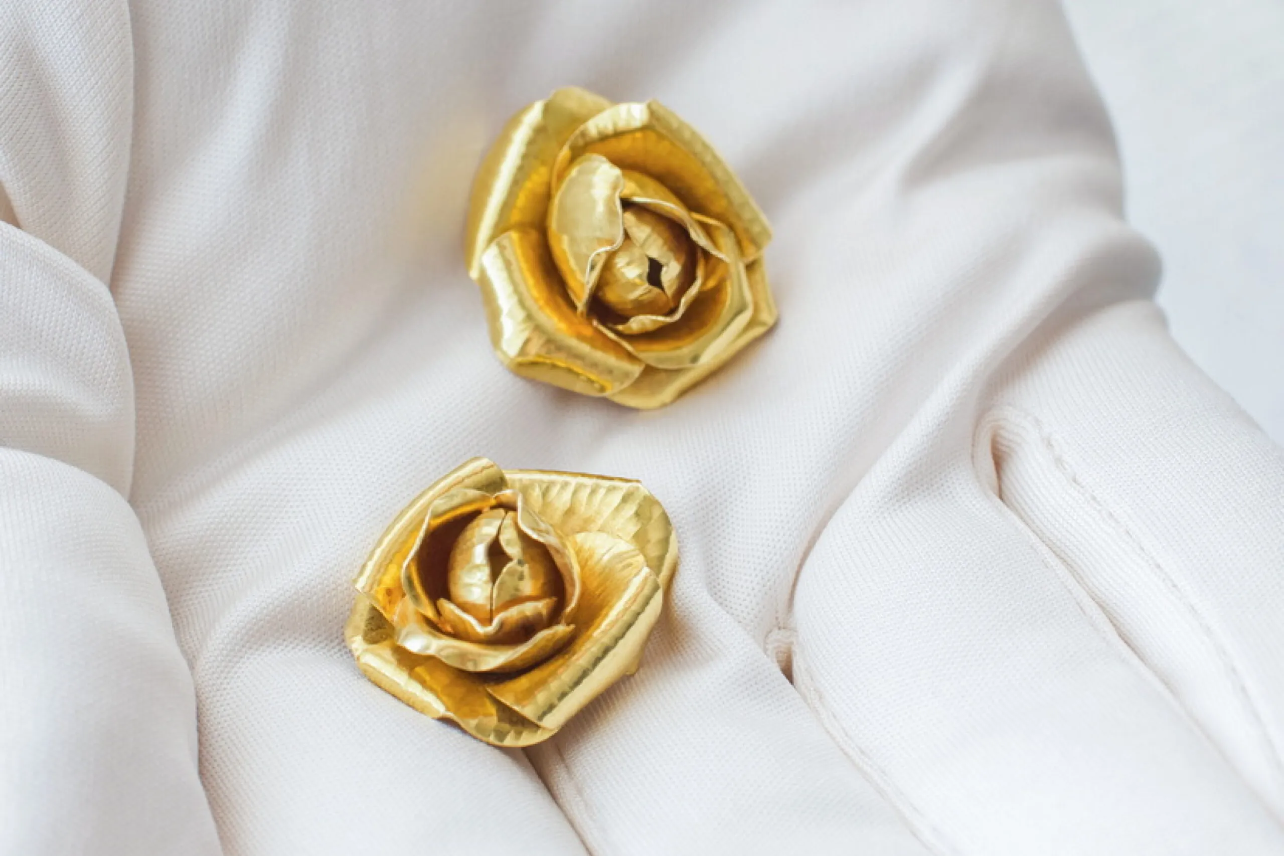 Hermès Gold Rose Petal Clip Earrings 1970s on White Glove