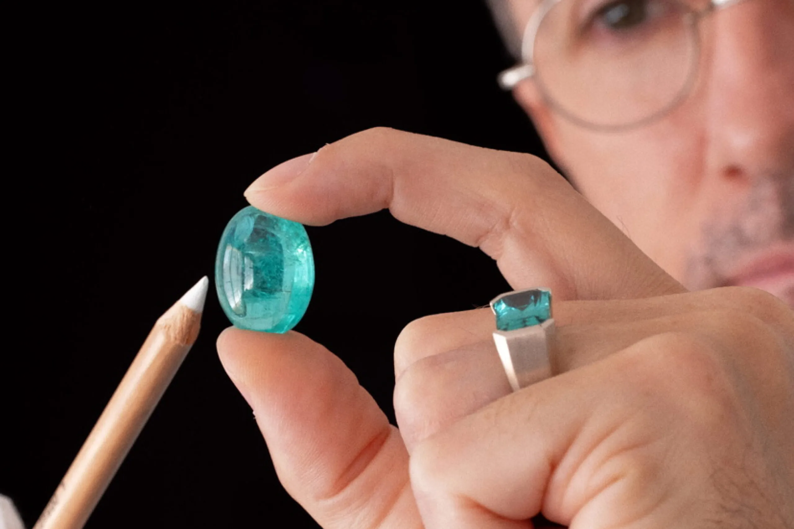 Eduard Grygorian holding gemstone in the hand